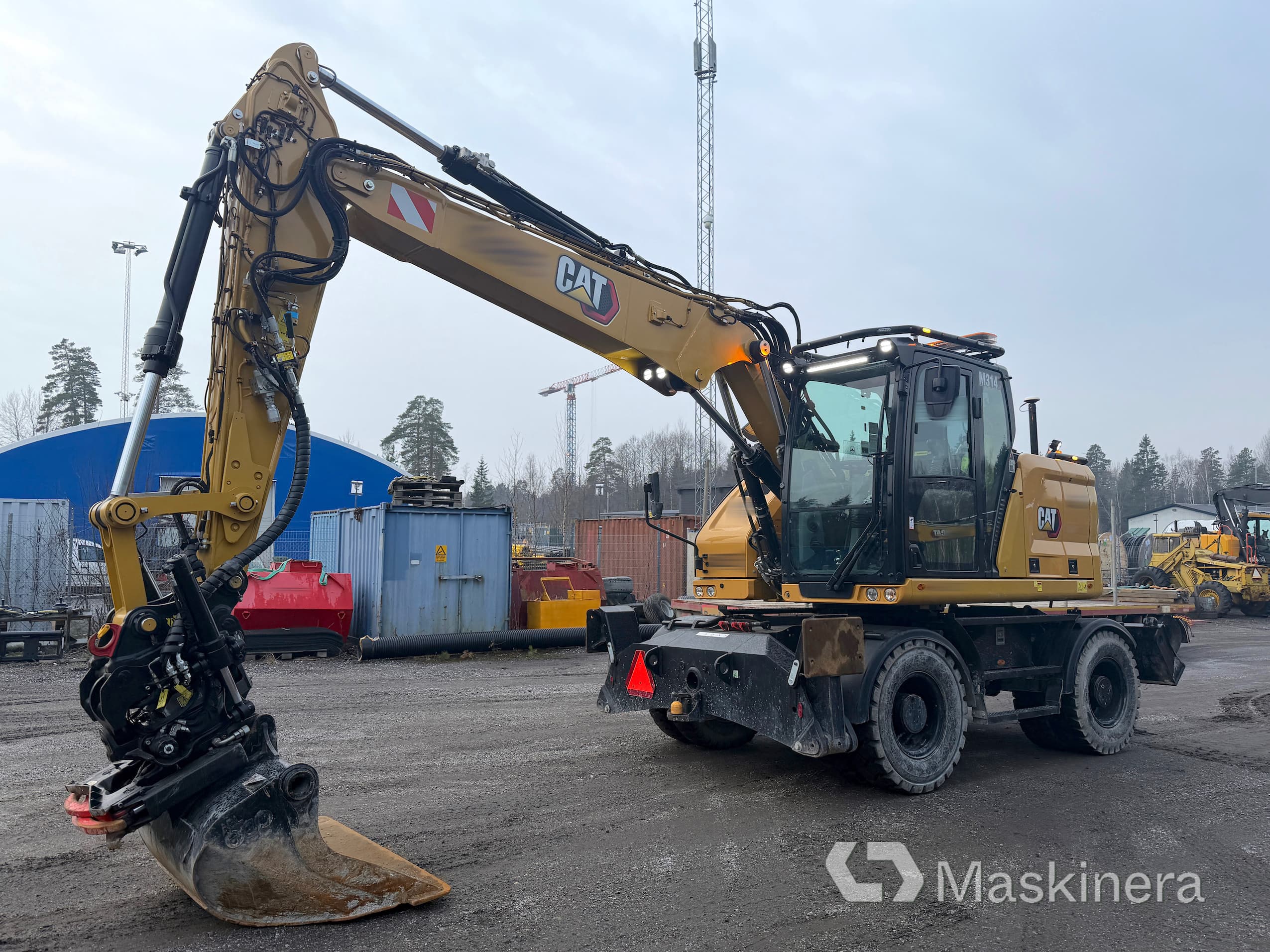 Hjulgrävare CAT M314 NG med GPS, vagn & skopor